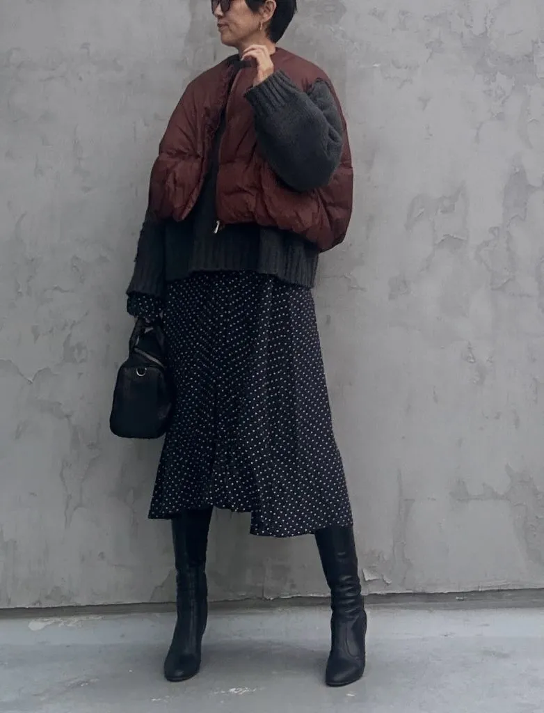 Midi Skirt Fall Outfit 2026 Burgundy Puffer Over Polka Dot Midi Skirt And Tall Boots