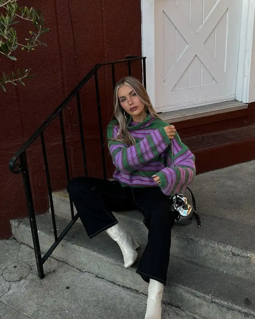 Early Fall Outfits 2026 Bold Striped Sweater With Black Flares and White Boots