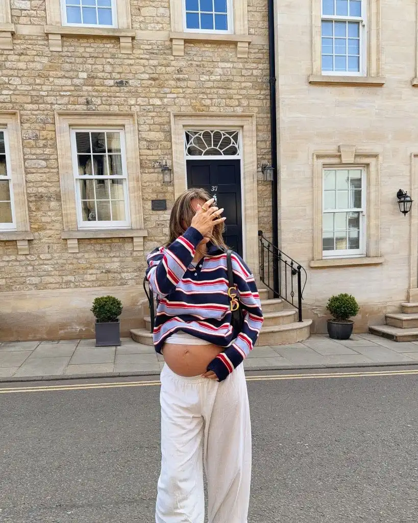 Fall Pregnancy Outfits 2026 Navy Striped Rugby Polo With White Linen Trousers