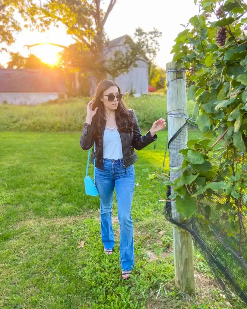 Fall Travel Outfits 2026 Black Leather Jacket With Blue Jeans For Golden Hour Walks