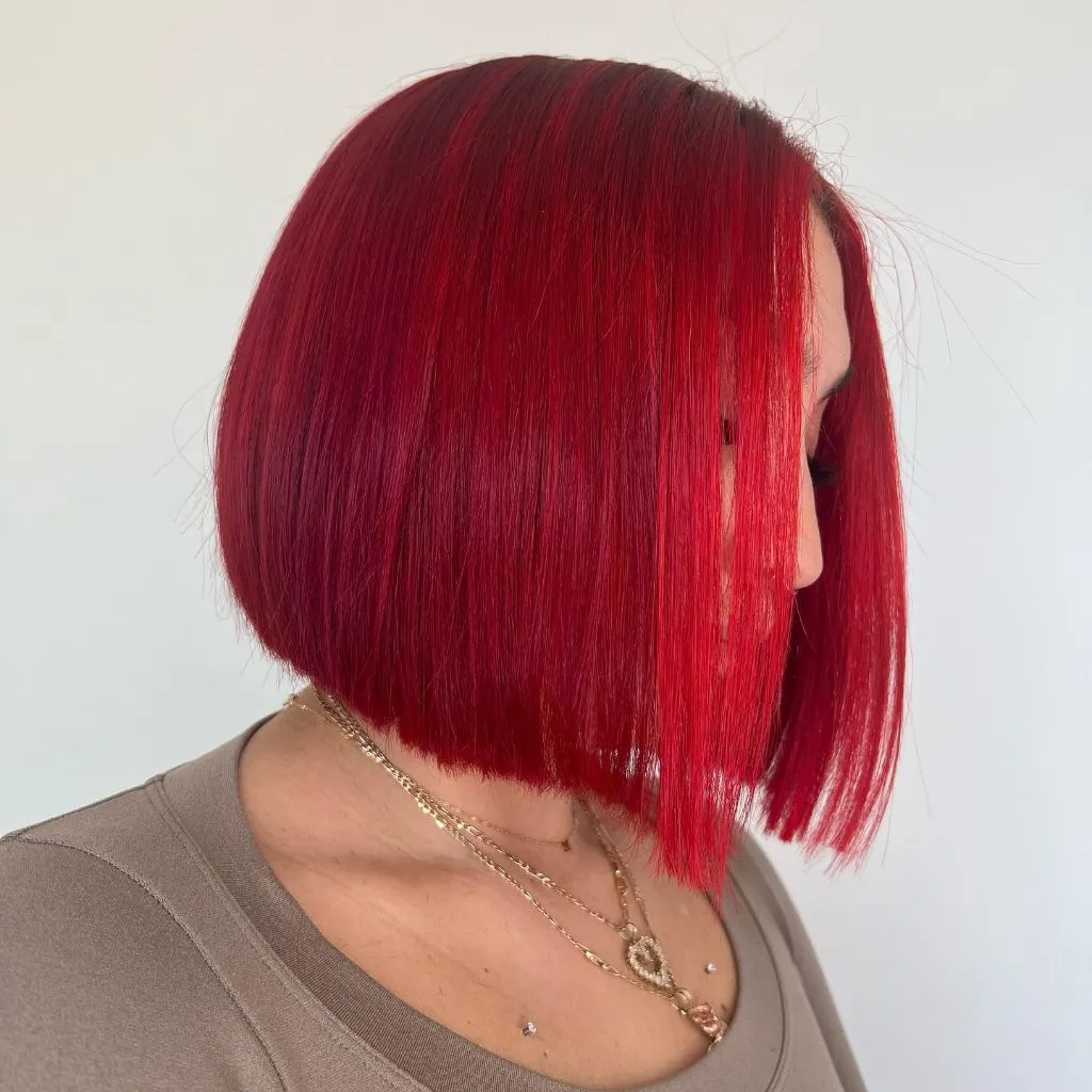 Bobbed Haircut for Women 2026 Vibrant Cherry Red Blunt Bob with Mirror Finish