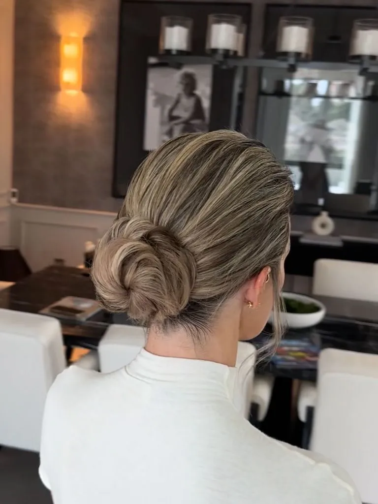 Fall Hairstyles for Office 2026 Classic Low Knot Bun with Sleek Side-Swept Finish