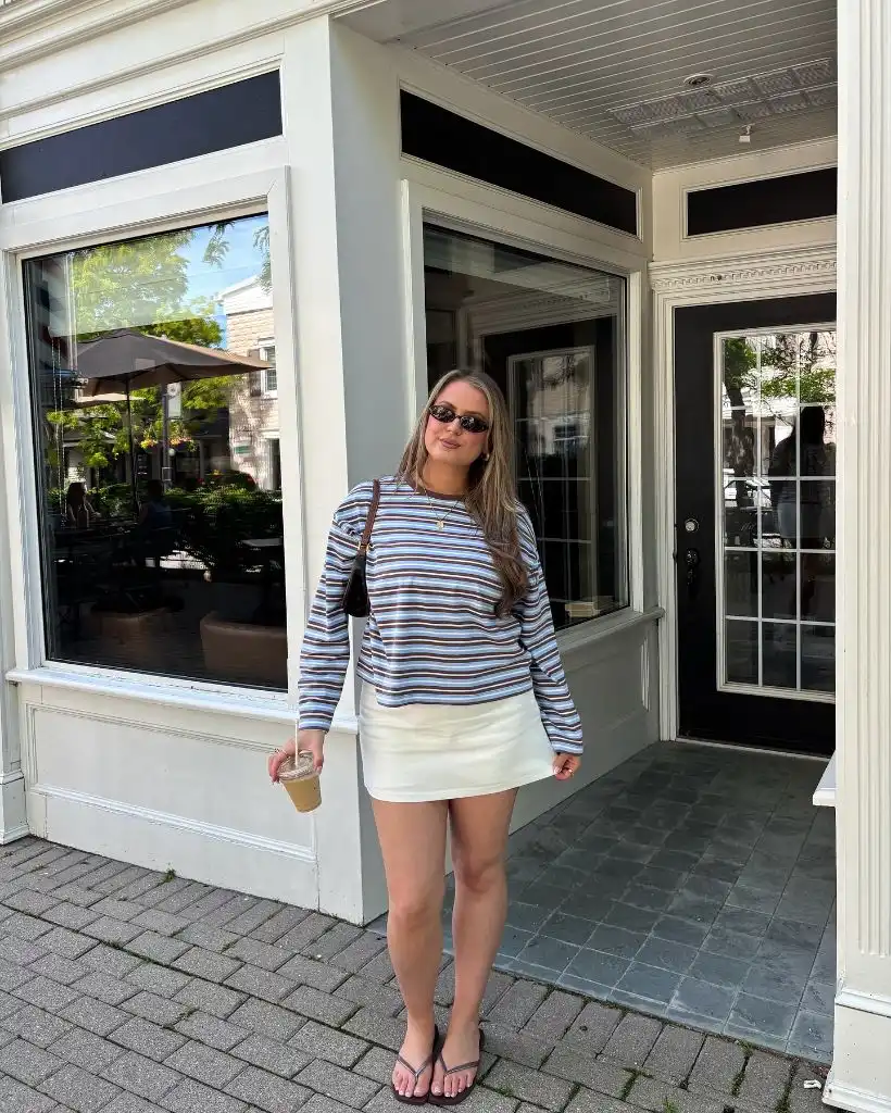 Wide Leg Jeans Outfit Fall 2026 Striped Tee With White Mini Skirt for Early Autumn