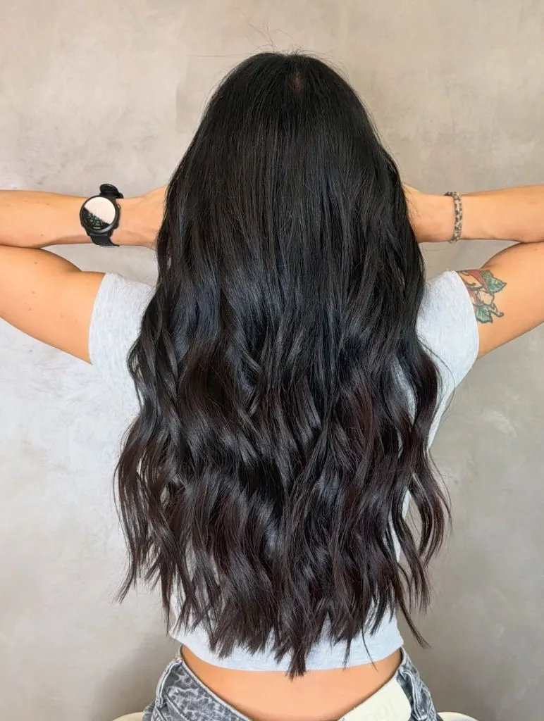 Fall Hair Colour Ideas 2026 Glossy Jet Black Waves with Maximum Length and Shine