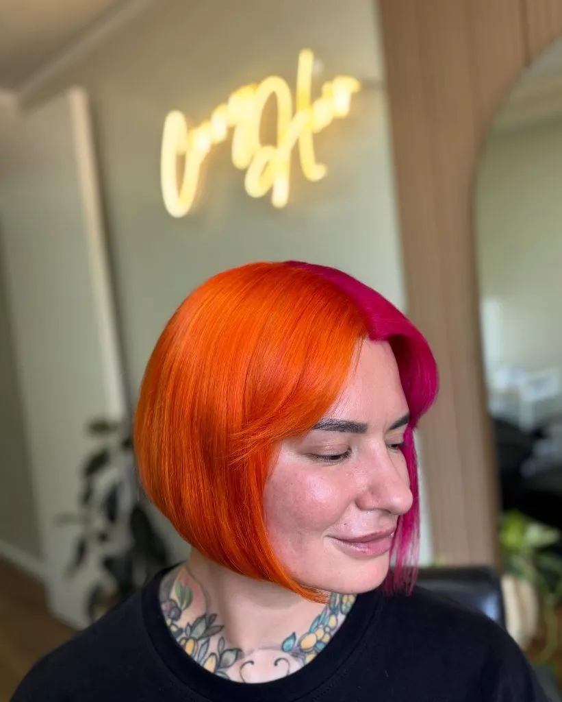 Fall Hair Colour Ideas 2026 Split-Dyed Neon Orange and Hot Pink Bob for Maximum Impact