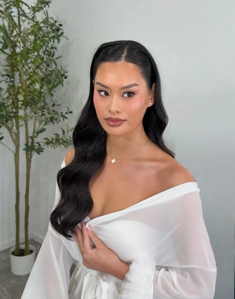 Fall Hairstyles for Wedding Guests 2026 Glossy Hollywood Waves with Deep Side Part