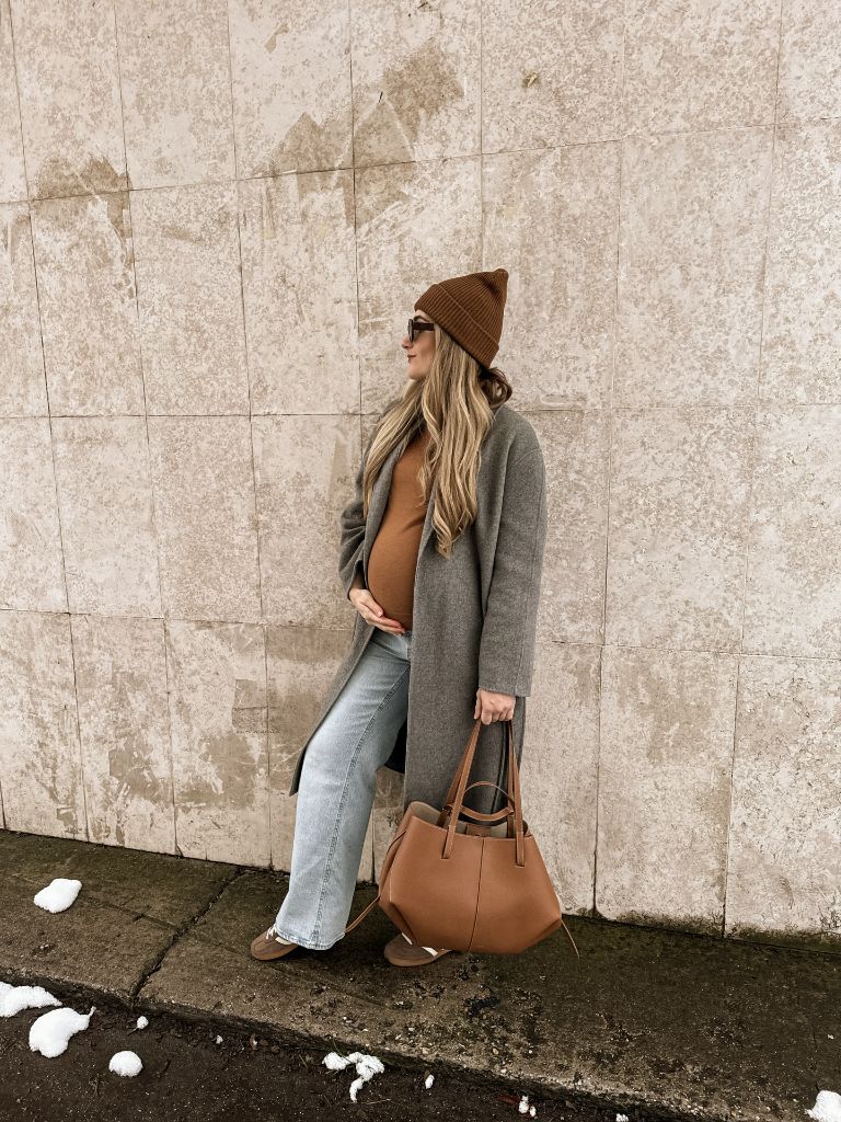 Fall Pregnancy Outfits 2026 Camel Sweater, Grey Wool Coat, and Wide-Leg Jeans