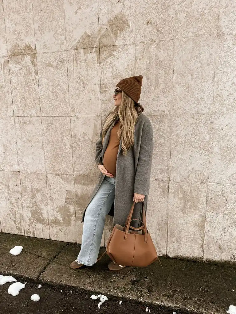 Fall Pregnancy Outfits 2026 Camel Sweater, Grey Wool Coat, and Wide-Leg Jeans