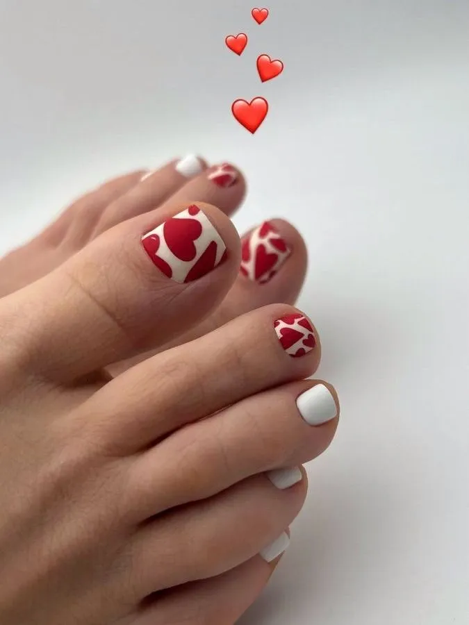 August Pedicure Nails Ideas 2026 Red and White Heart-Print Toes for a Bold Valentine-in-August Mood