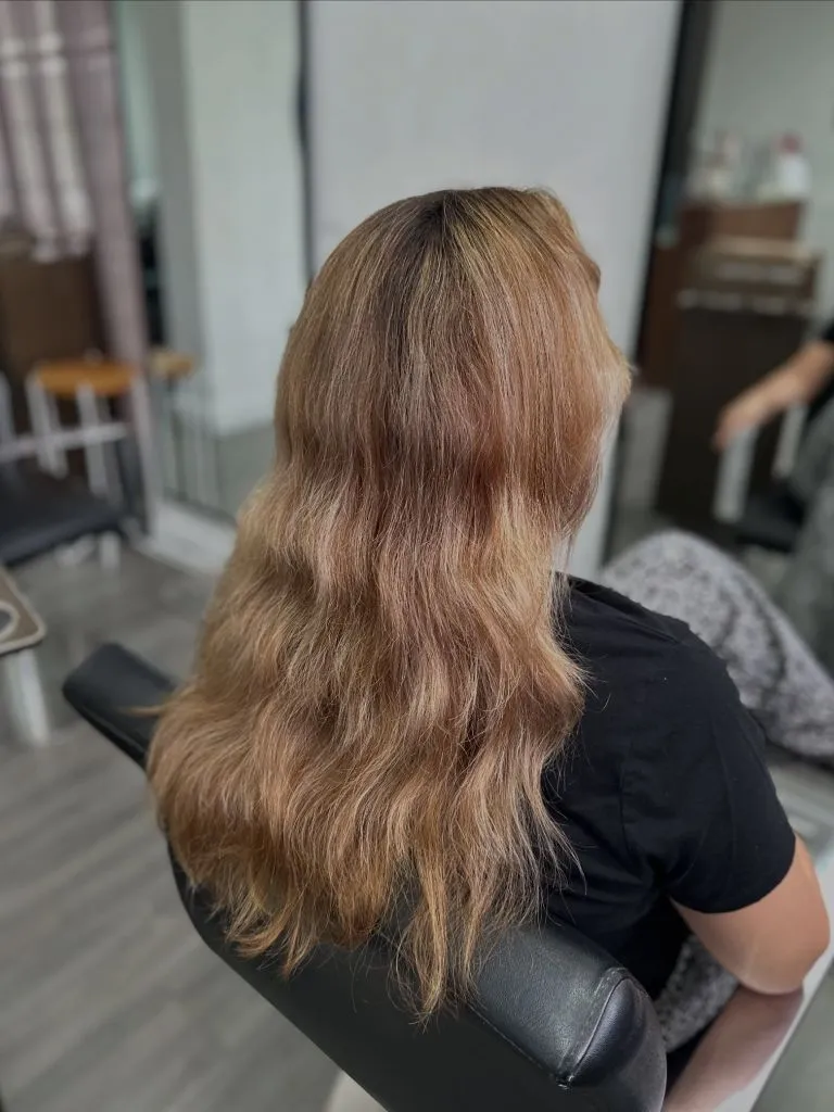 Fall Haircuts for Women 2026 Long Warm Strawberry Blonde Waves With Natural Texture