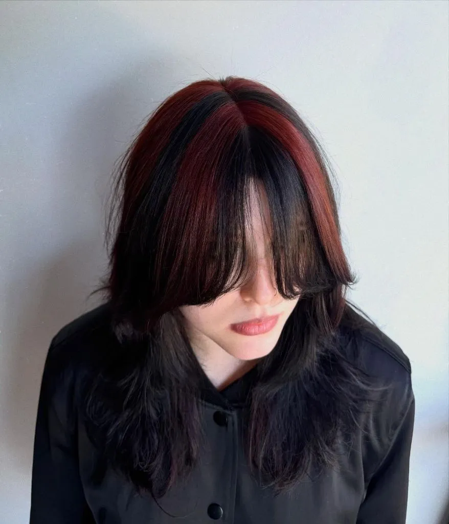 Fall Short Haircuts 2026 Bold Red-And-Black Layered Shag With Long Curtain Bangs
