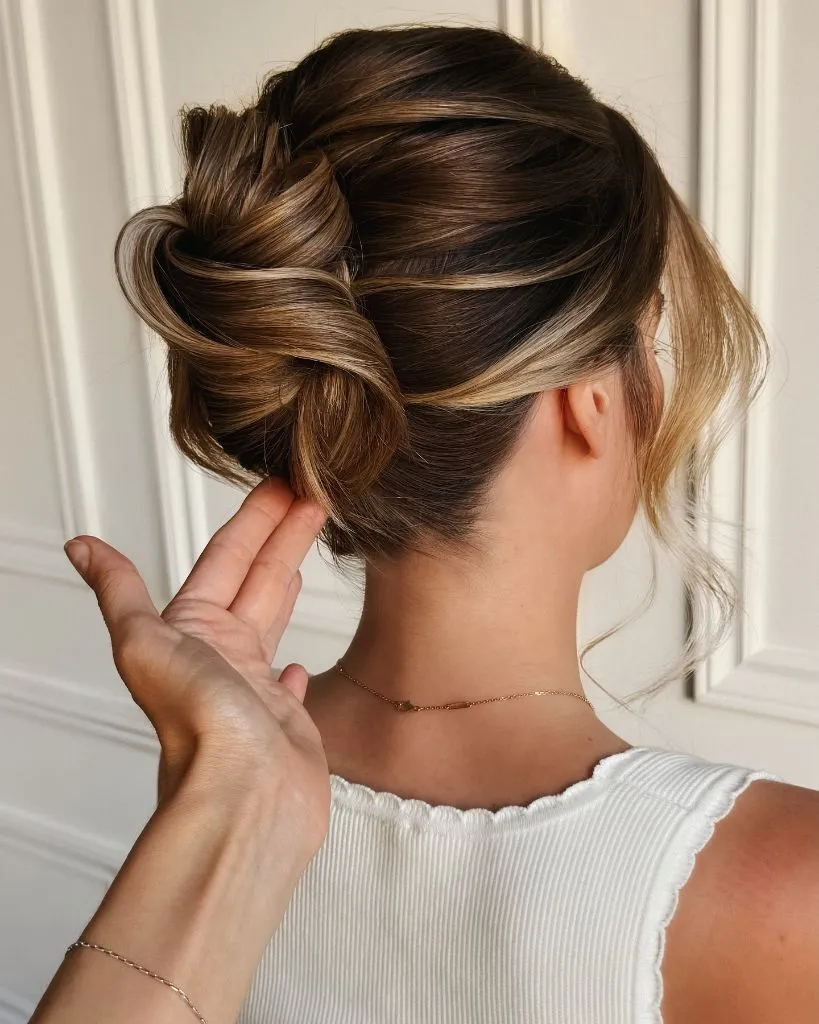 Fall Hairstyles for Office 2026 Romantic Low Twisted Chignon with Warm Highlighted Dimension