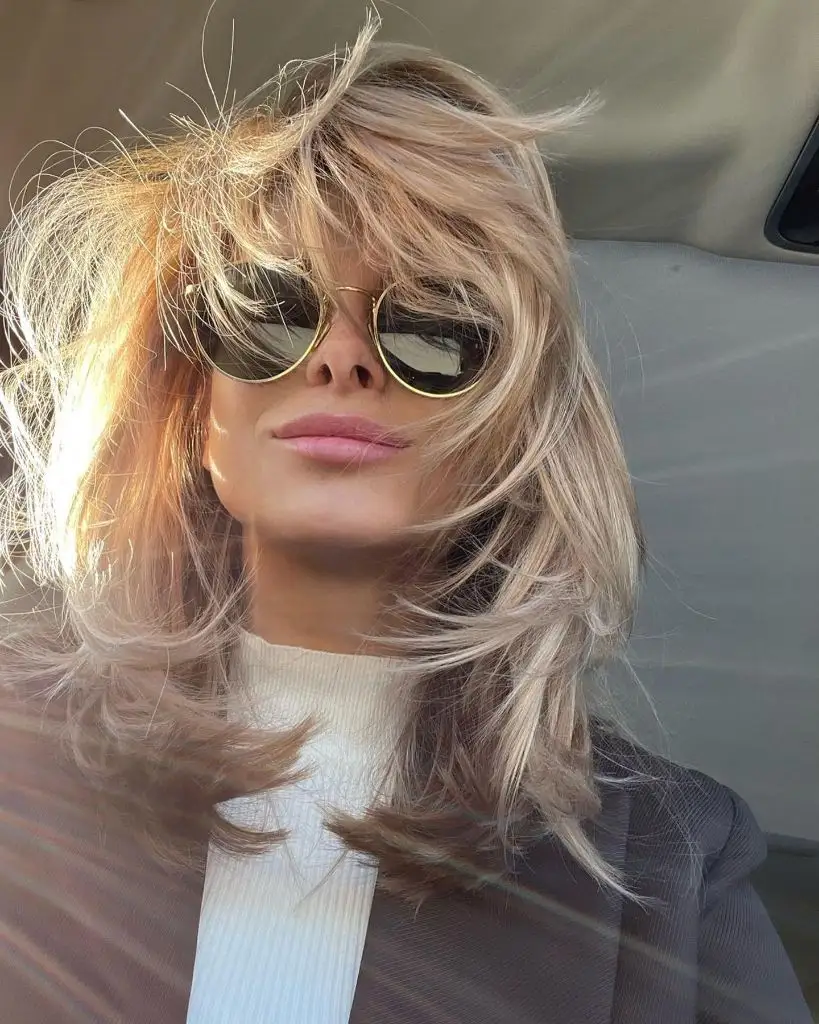 Fall Medium Haircuts 2026 Tousled Blonde Shag With Textured Layers and a Sun-Faded Finish