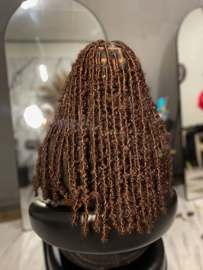 Locs Hairstyles for Black Women 2026 Warm Brown Butterfly Locs with Soft Curly Texture