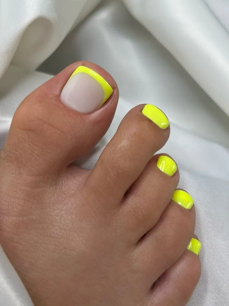 August Pedicure Nails Ideas 2026 Neon Yellow French Tip Toes for a Late-Summer Pool Day