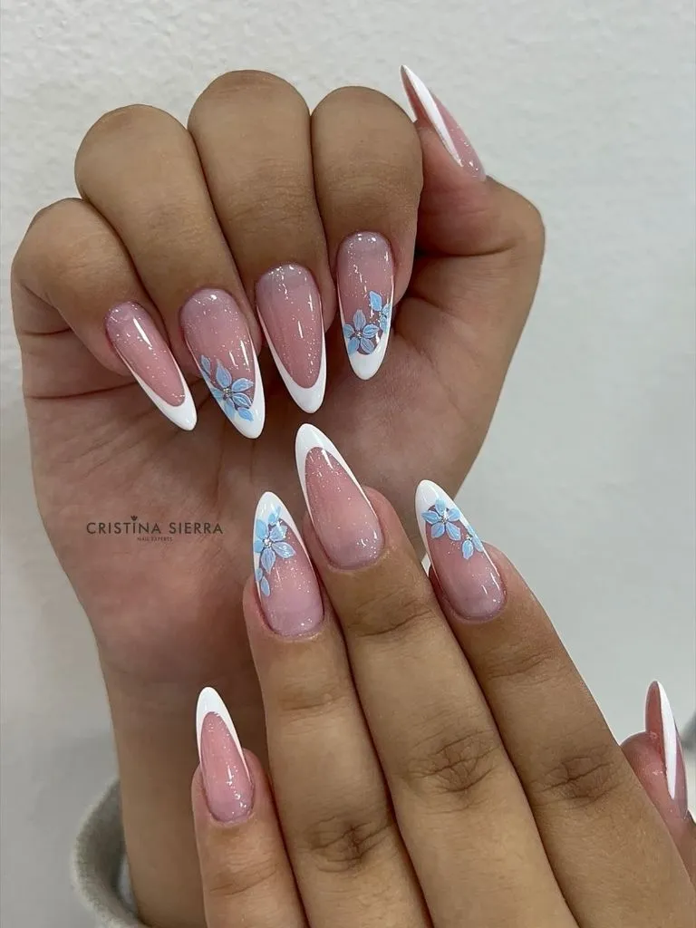 August Nails Color 2026 White French Tip Almond Nails With Blue Floral Accent for a Classic August Refresh