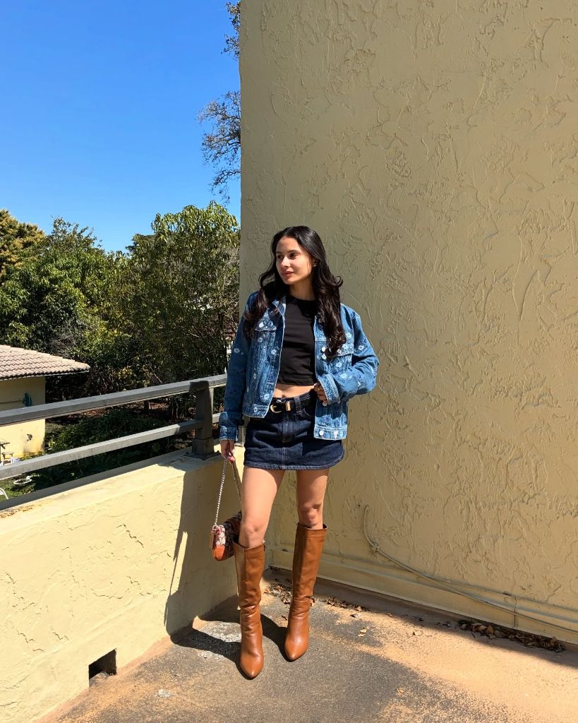 Nice Fall Outfits 2026 Denim Jacket and Mini Skirt With Cognac Tall Boots for a Western Twist