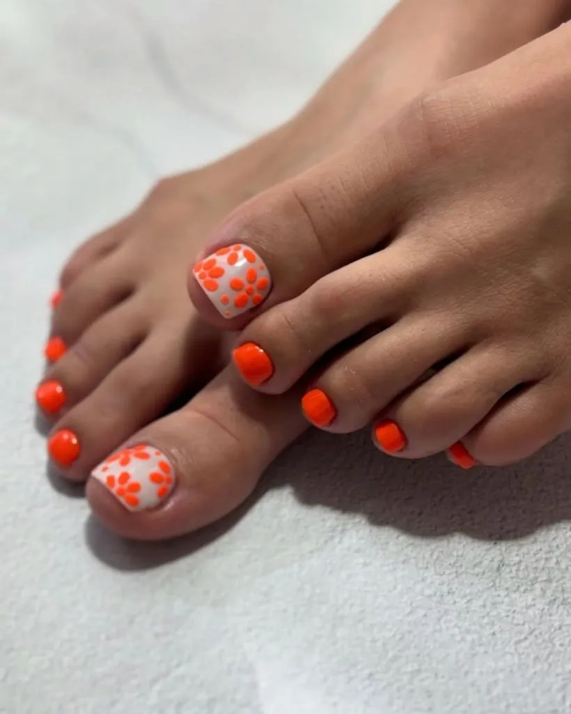 Fall Pedicure Ideas 2026 Bright Orange Floral Accent Pedicure on Short Square Nails