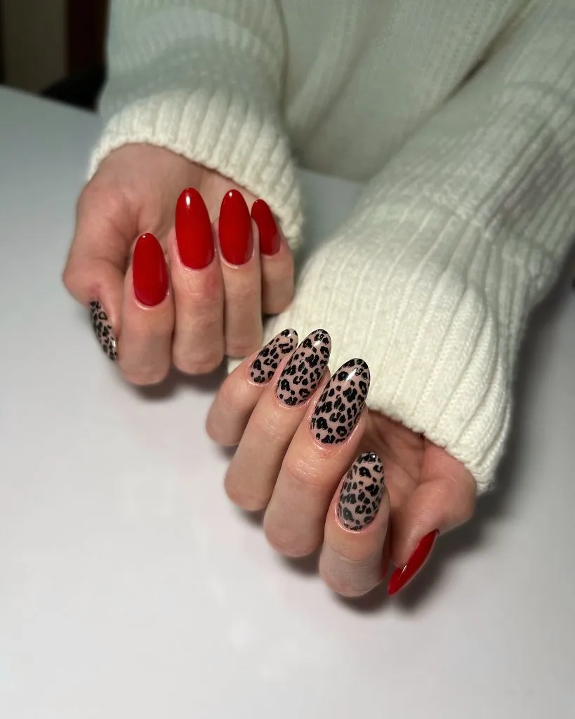 Fall Medium Nail Ideas 2026 Glossy Red Almond Nails With Leopard Print Accent Hand