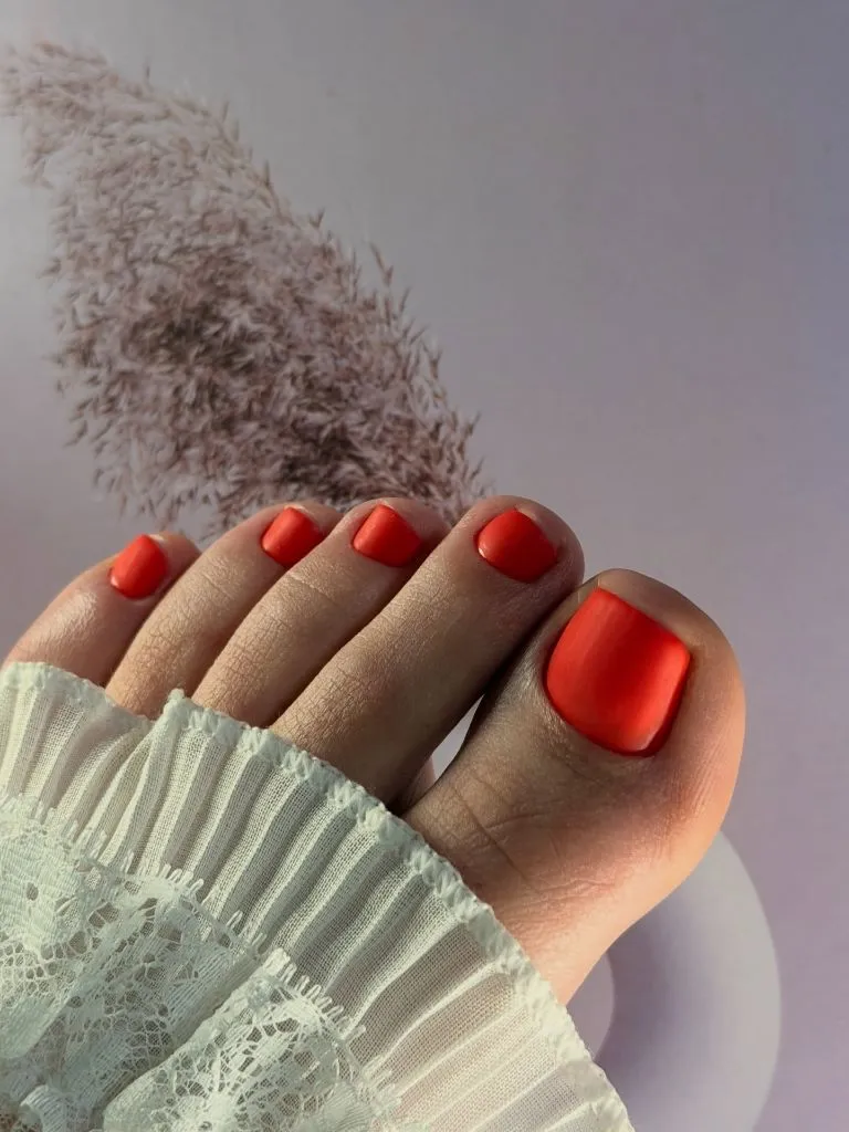 Fall Pedicure Ideas 2026 Matte Coral Orange Pedicure on Short Square Toenails