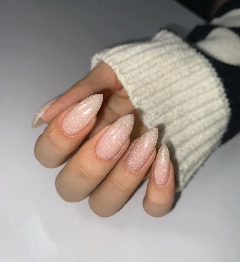 Fall Almond Nails 2026 Nude Shimmer Almond Nails With Fine Glitter Overlay