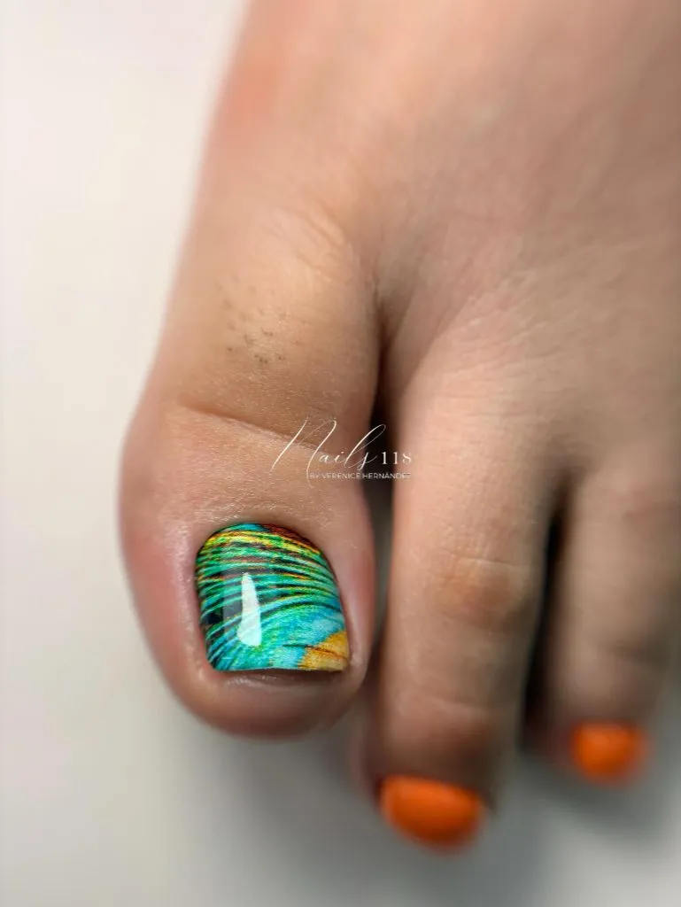 Fall Pedicure Ideas 2026 Peacock Feather Nail Art With Orange Accent on Short Toenails
