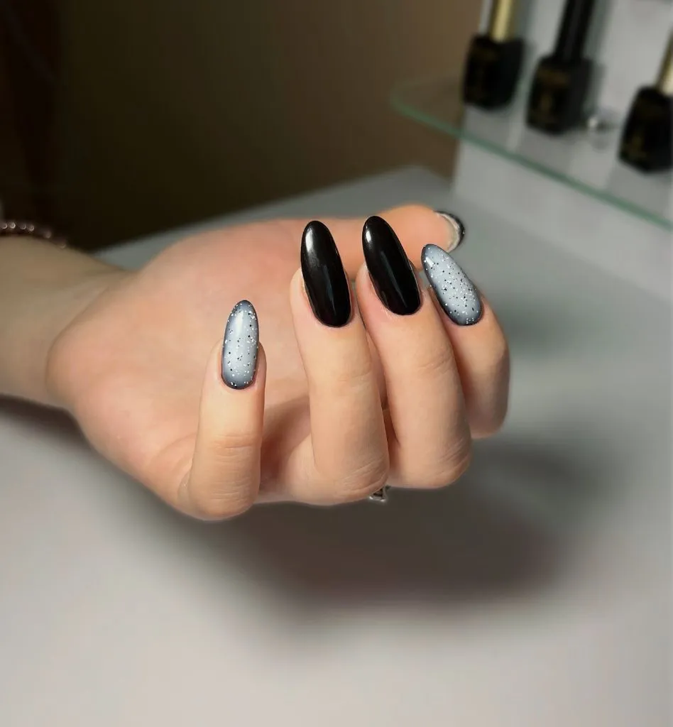 Fall Medium Nail Ideas 2026 Black and Grey Speckled Almond Nails With Alternating Glossy Finish