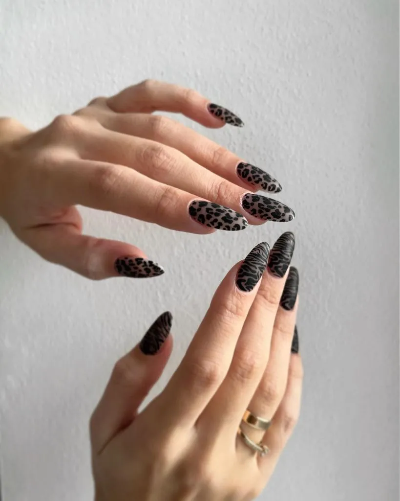 Fall Medium Nail Ideas 2026 Dark Brown and Black Animal Print Almond Nails With Mixed Leopard and Zebra Patterns