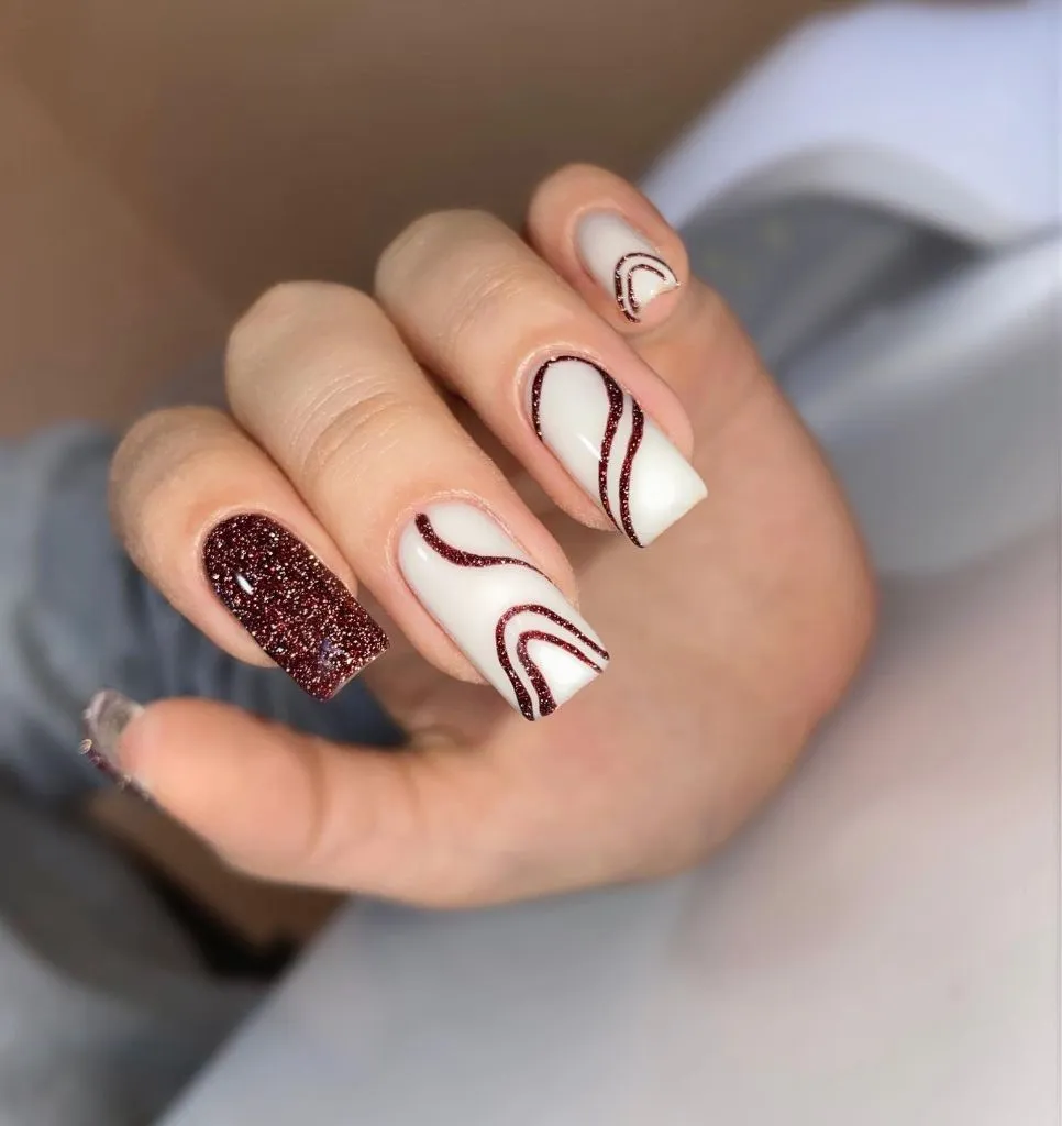 Fall Almond Nails 2026 White and Burgundy Glitter Swirl Square Nails With Accent Sparkle