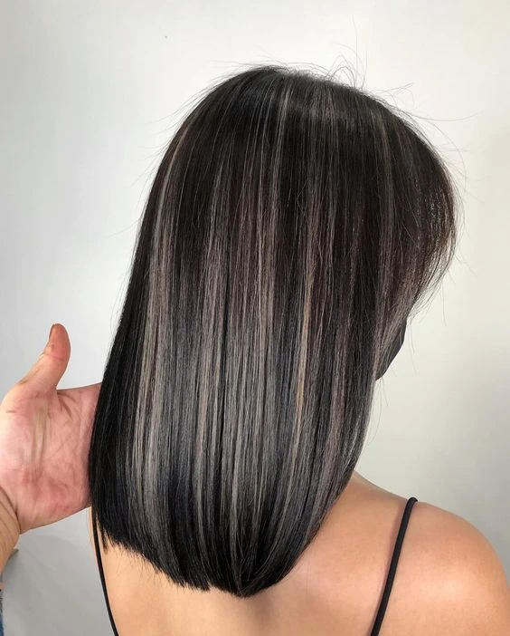 Subtle babylights on black-brown hair