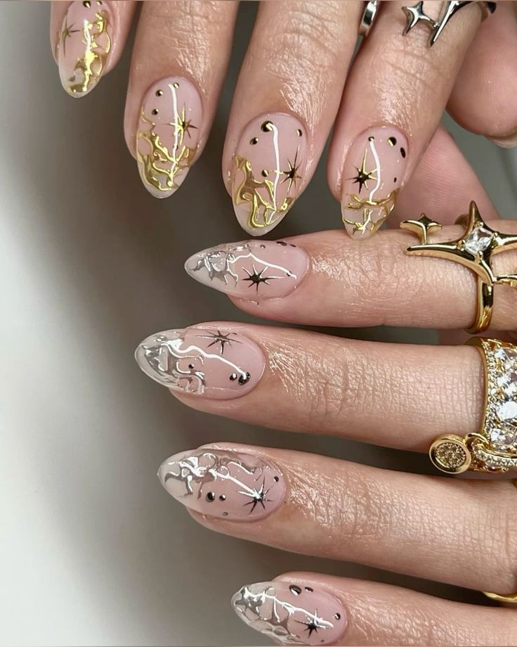 Gold and Silver Starburst Almond Nails new years eve nails design