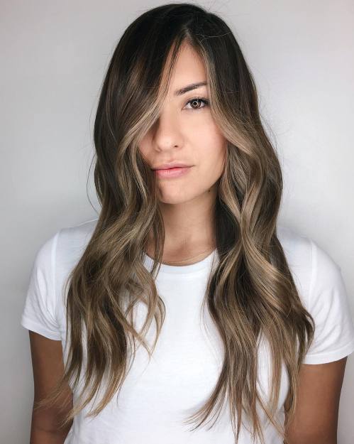 Ash brown partial balayage highlights on dark hair