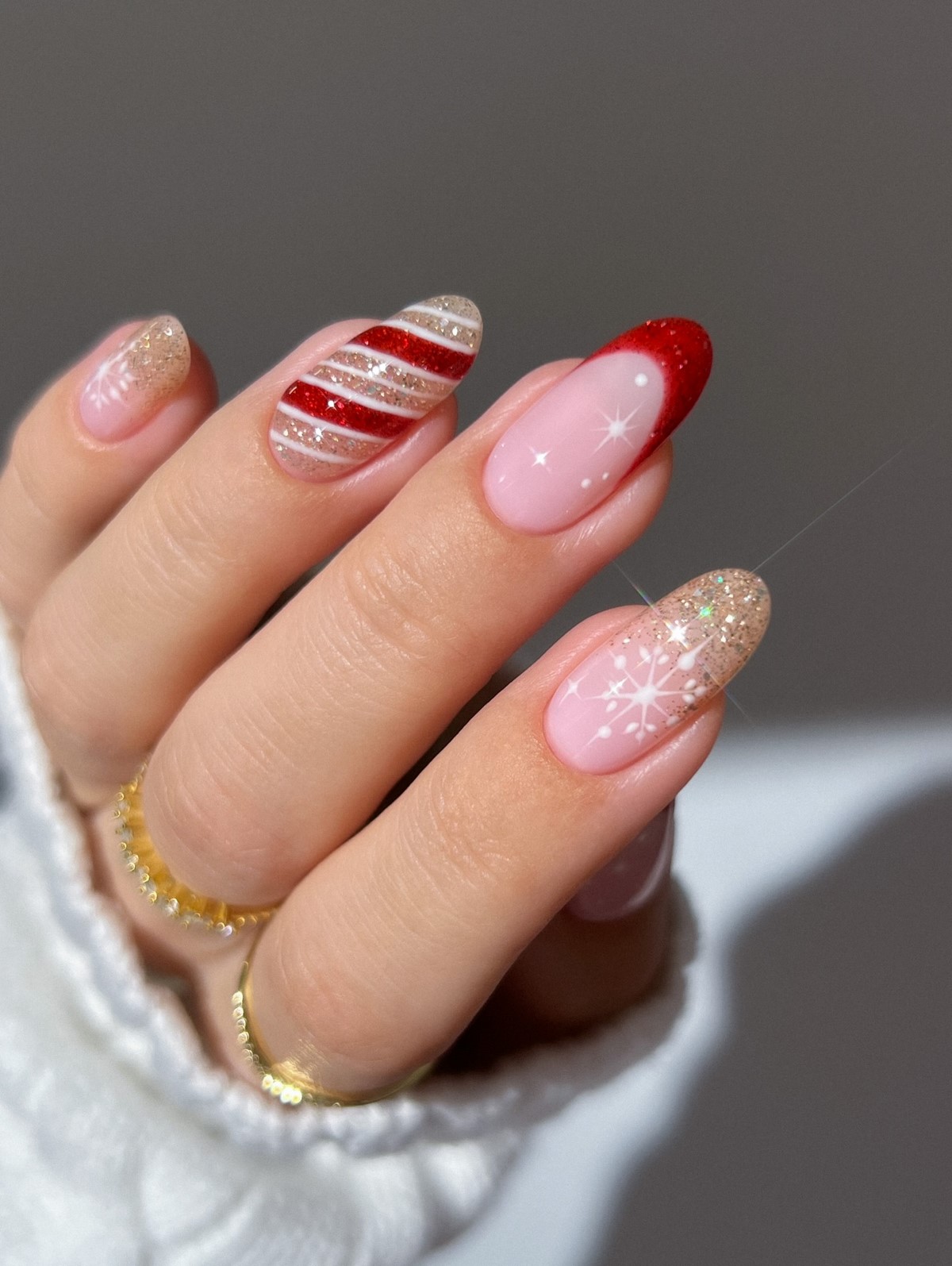 Red Glitter Stripes, Stars and Snowflake Almond Nails festive Christmas nail art