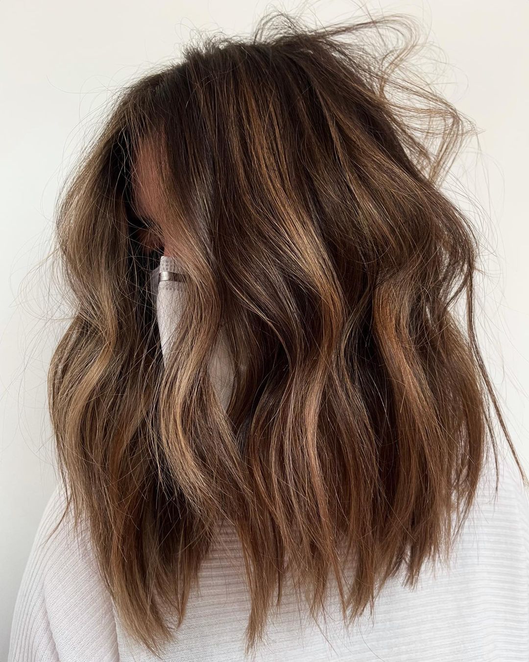 Messy brown waves with blended partial balayage streaks