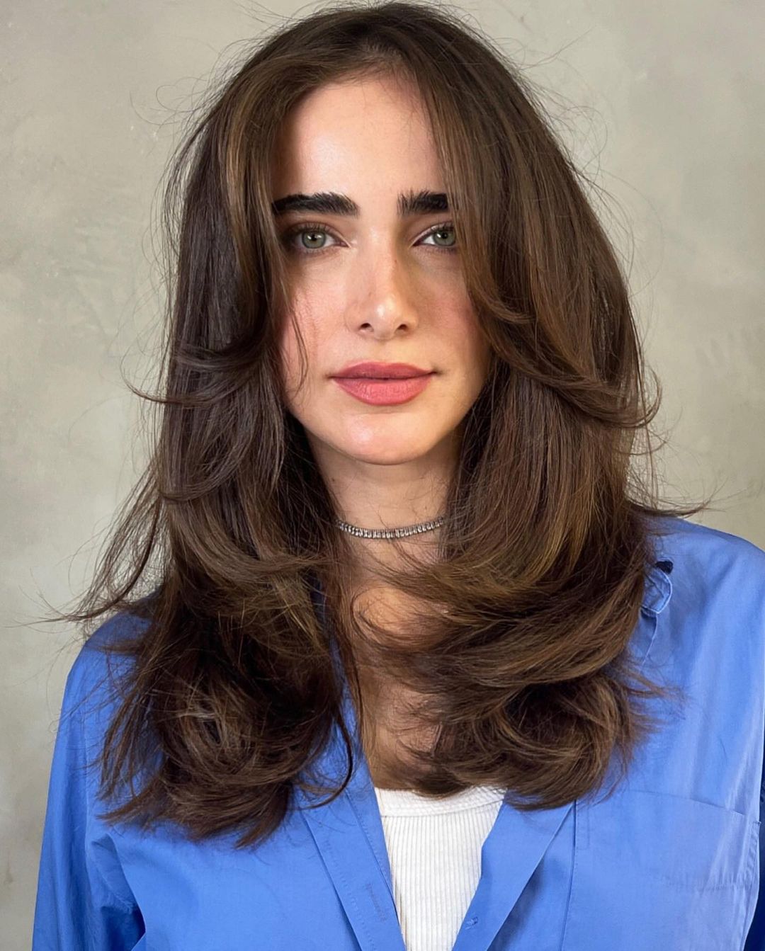 Butterfly cut with flowing front layers medium hair