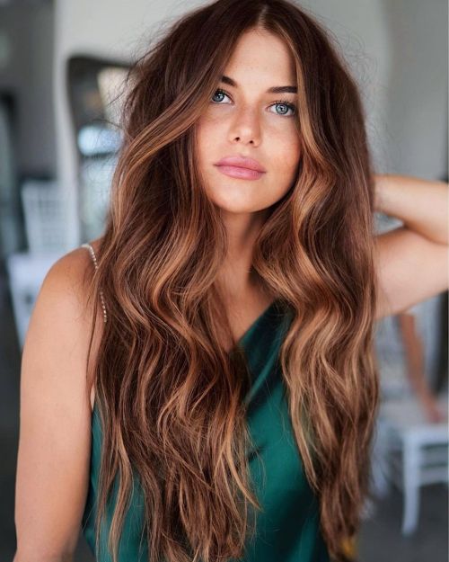 Red-Brown Lengths with Warm Highlights red hair color