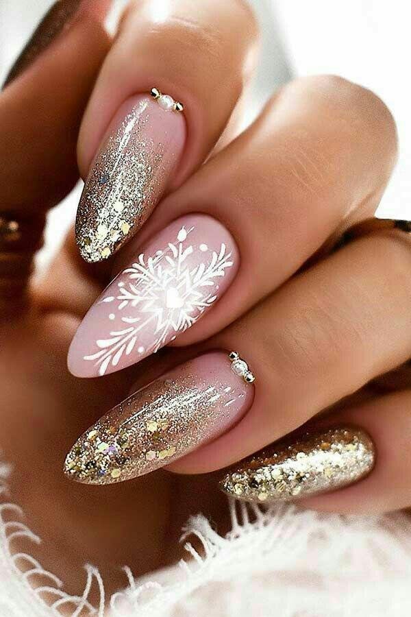 Elegant Snowflake Nails with Gold Glitter Accents snowflake nail art design