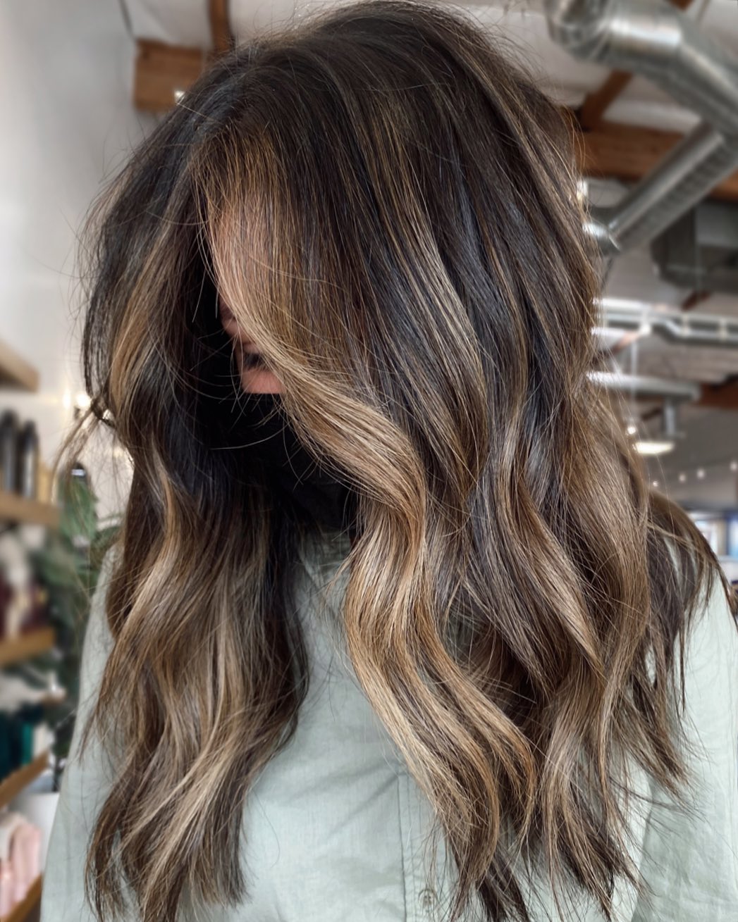 Sandy blonde partial highlights on a dark hair base