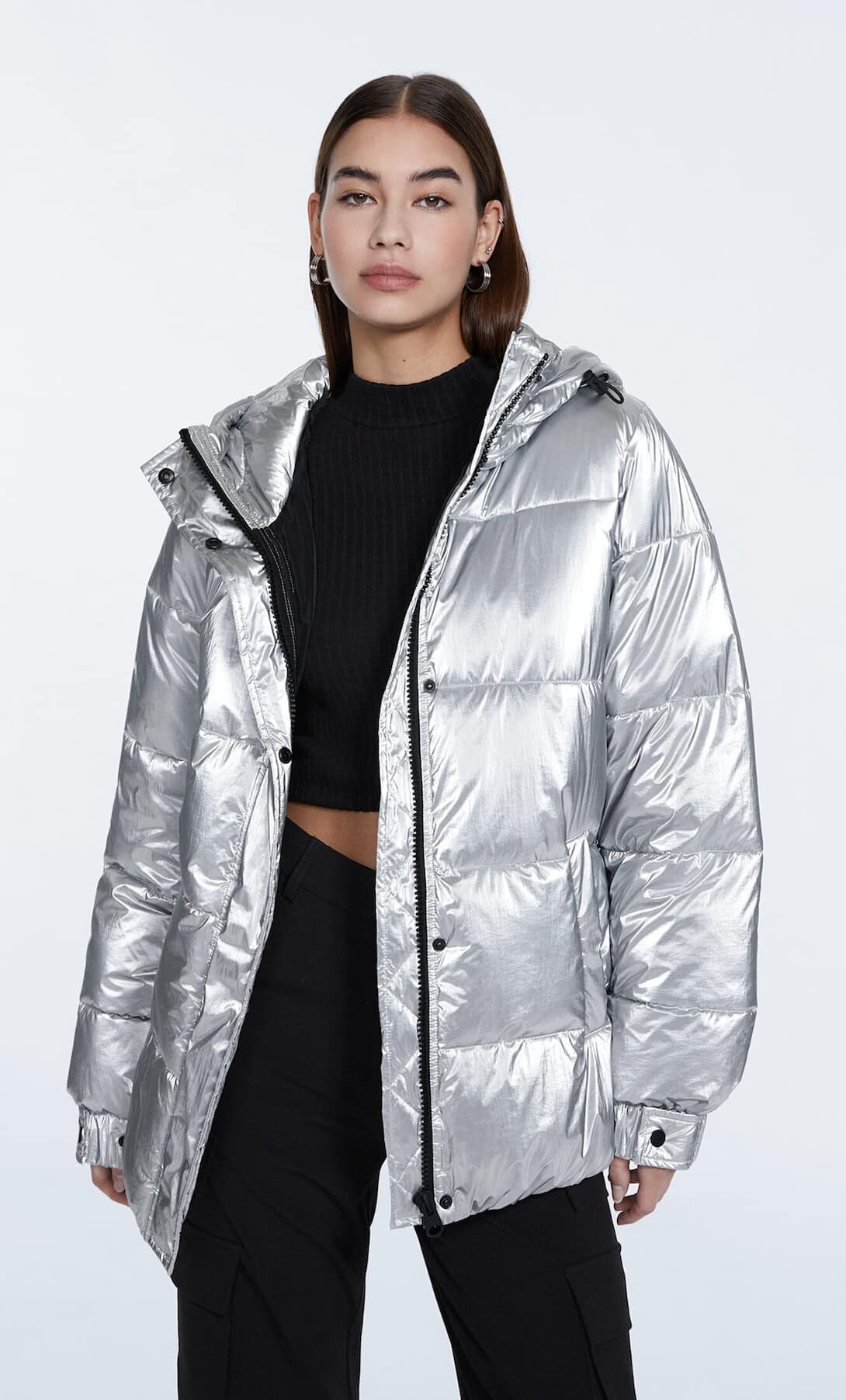 Woman wearing a metallic silver puffer coat