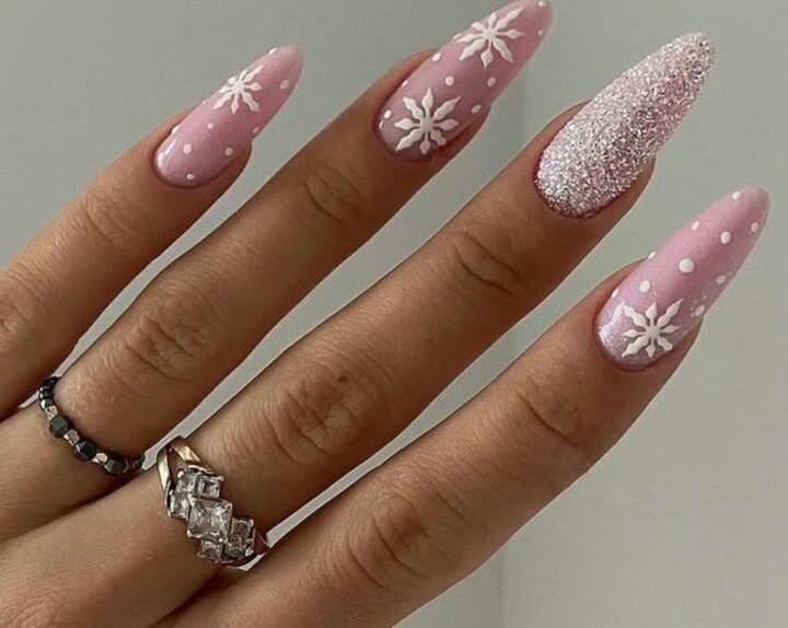 Matte Pink Snowflake Nails with a Silver Glitter Accent snowflake nail art design