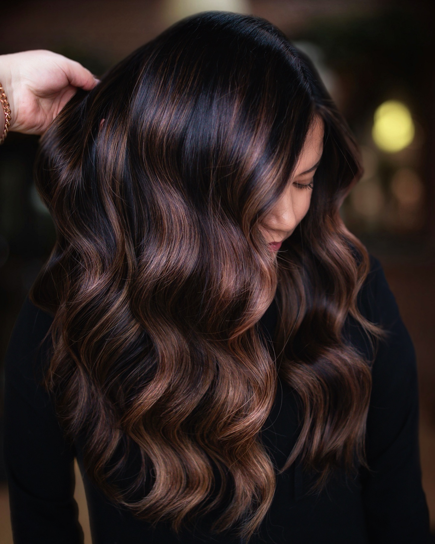 Caramel highlights that light up an espresso base brown highlights