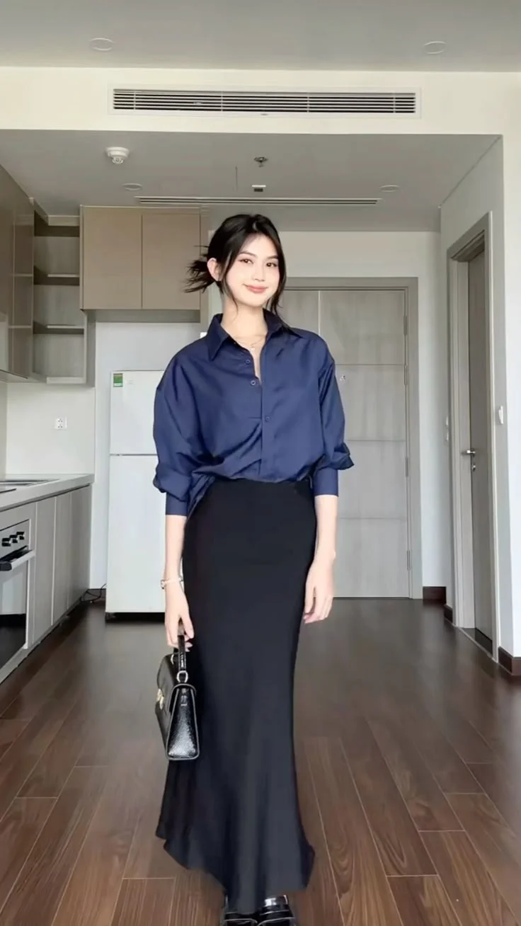 Deep navy shirt and structured handbag with black satin skirt outfit