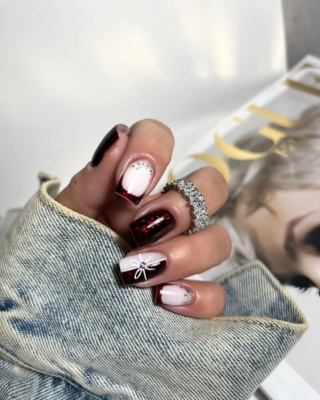 Dark Wine with White Bows December nail manicure