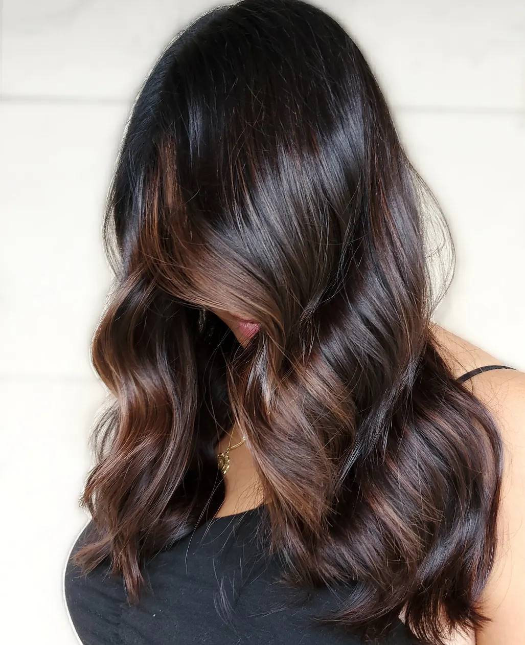 Subtle face-framing partial highlights for brunettes