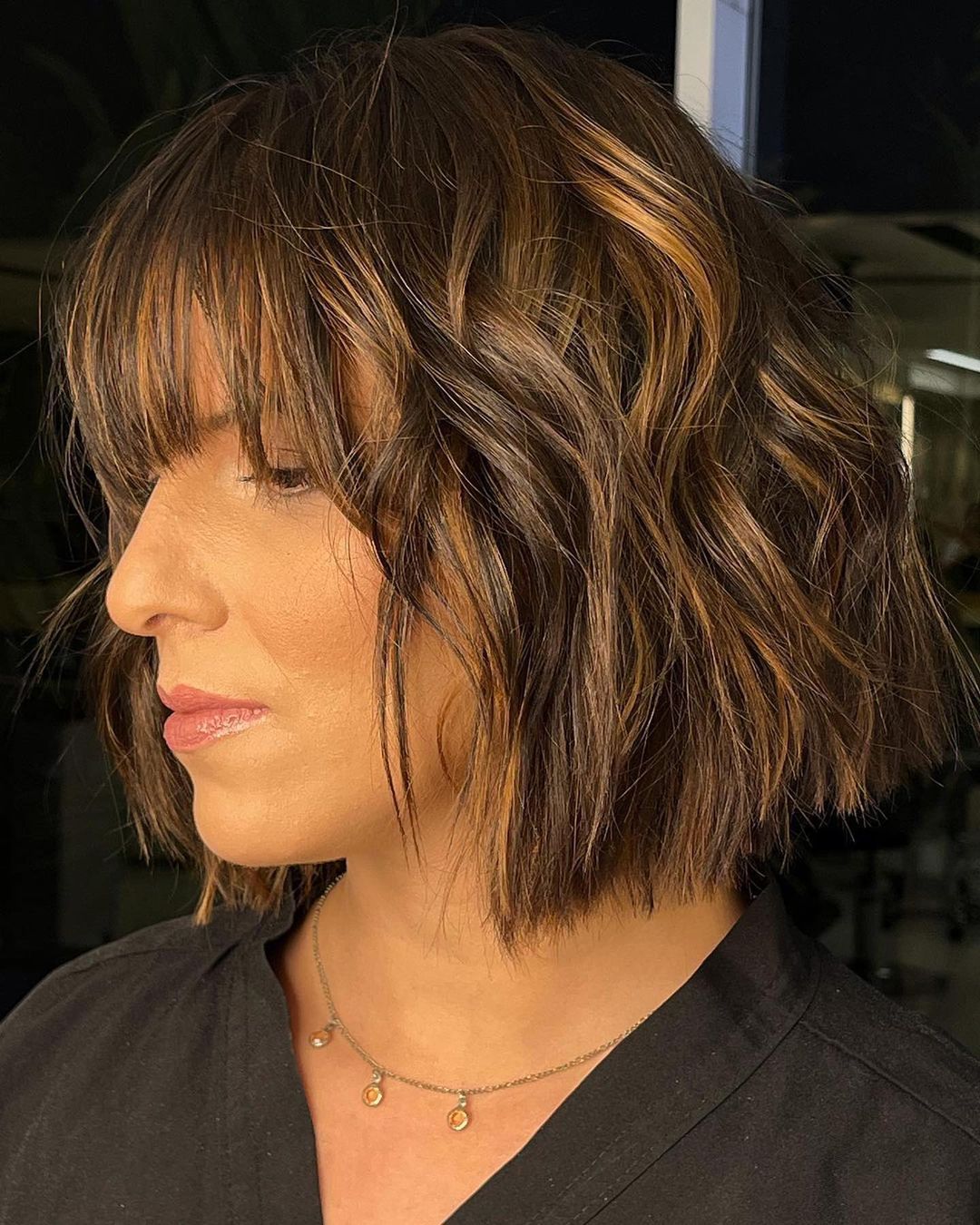 Short caramel brown bob with bangs