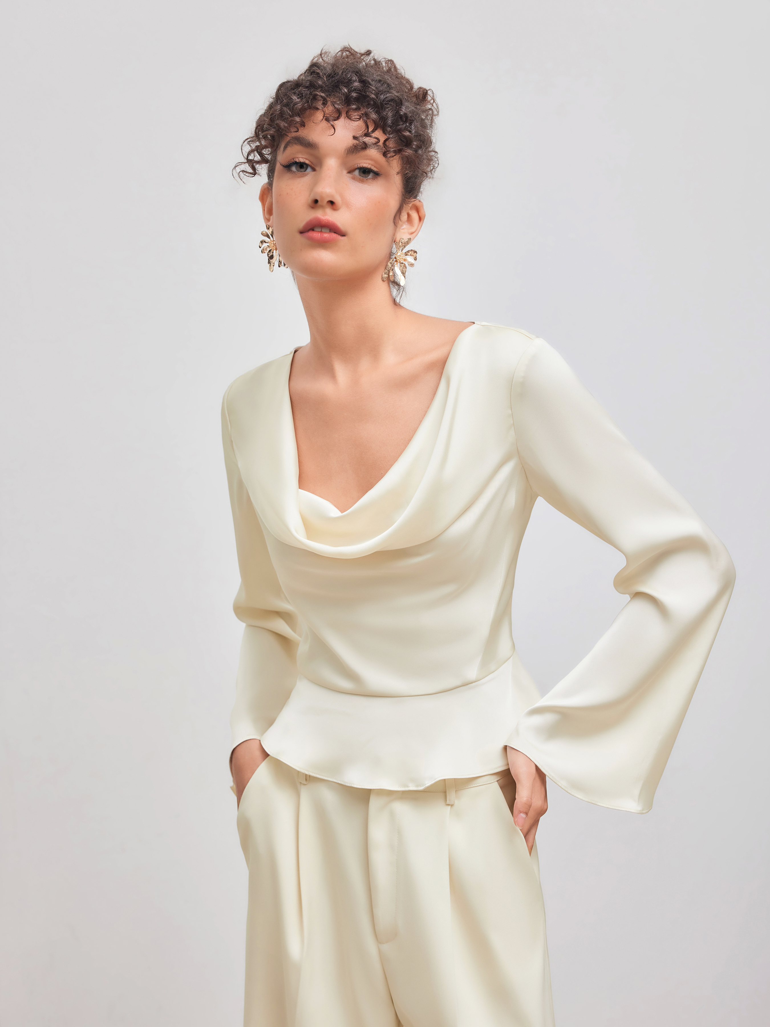 Satin cowl-neck top with wide-leg trousers for a night out