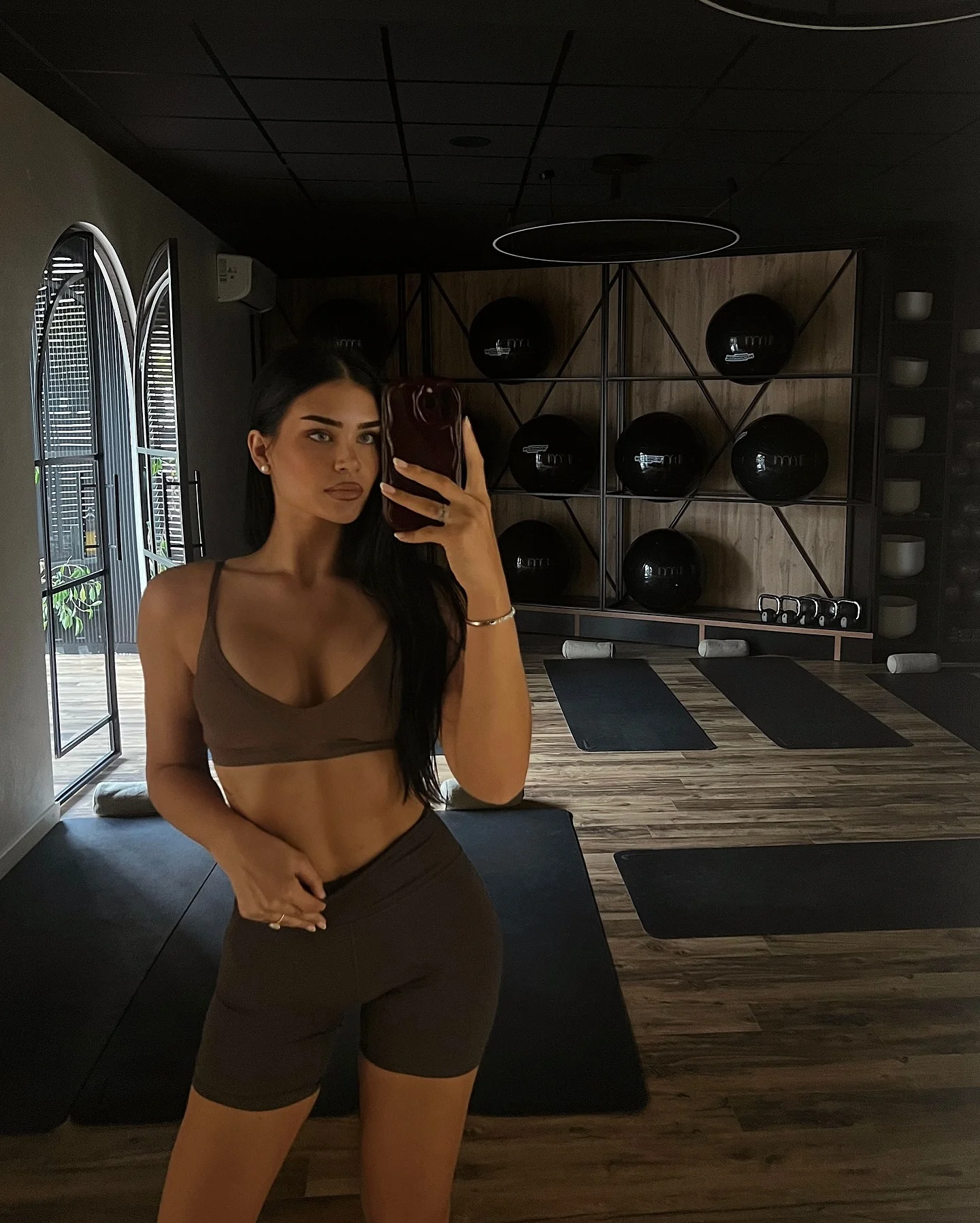 Espresso brown pilates bra and bike shorts pilates outfit
