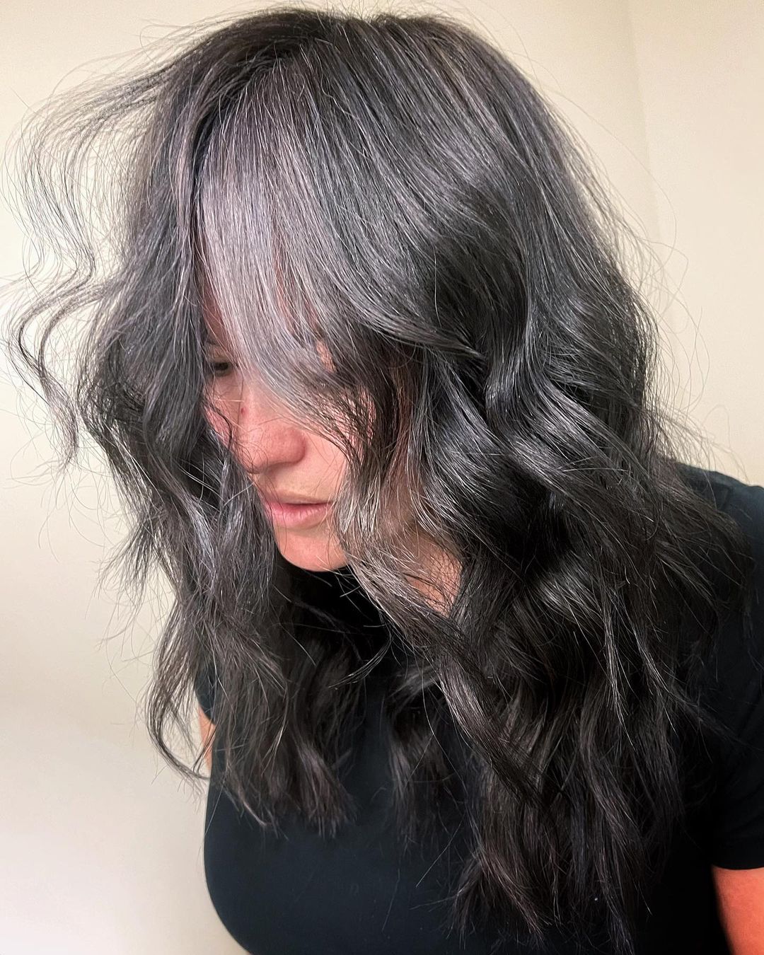 Silver babylights scattered through black hair