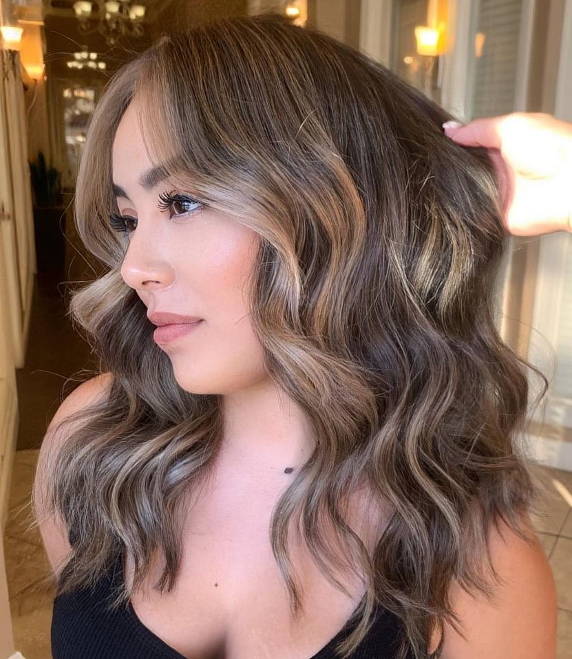 Blended caramel highlights on layered hair