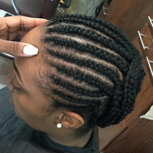 Cornrows styled into a bun updo